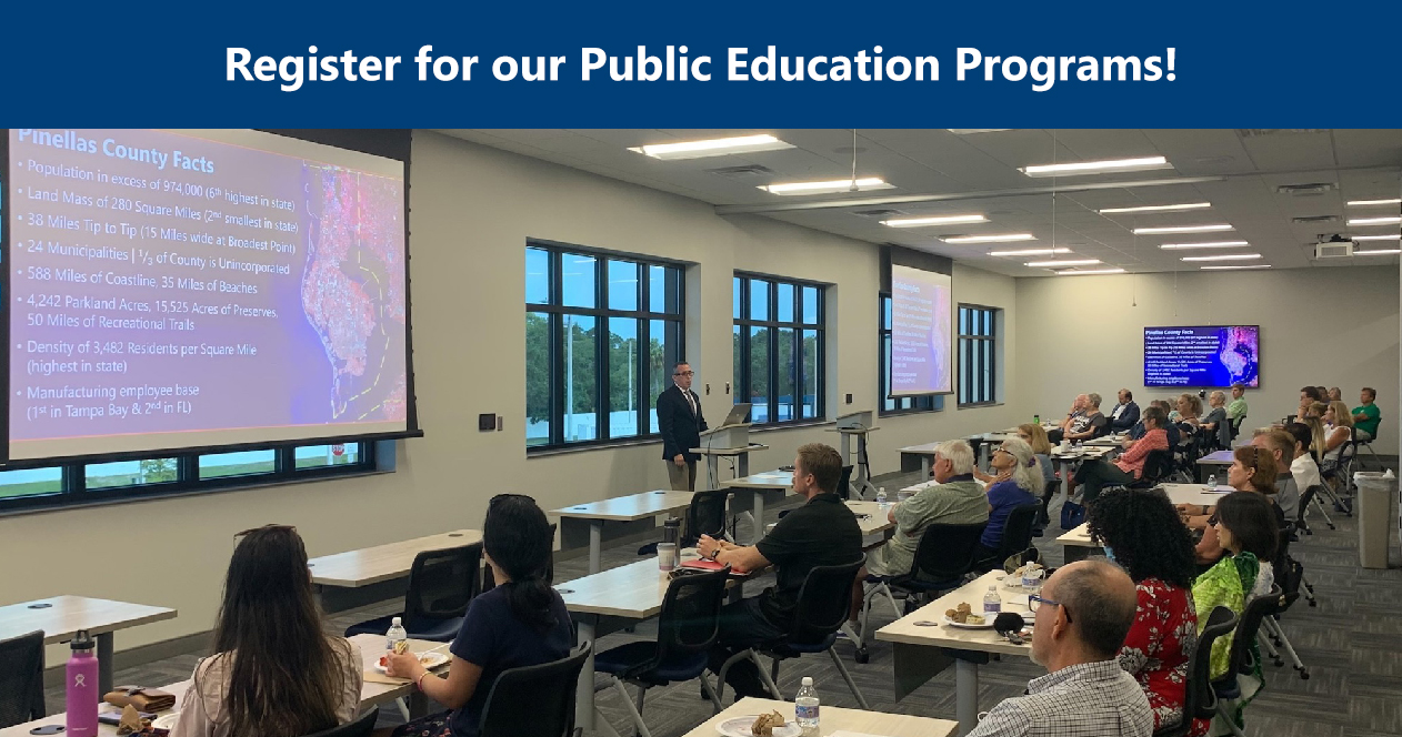 Image: sign up for our public education programs. Image depicts attendees listening to a presentation